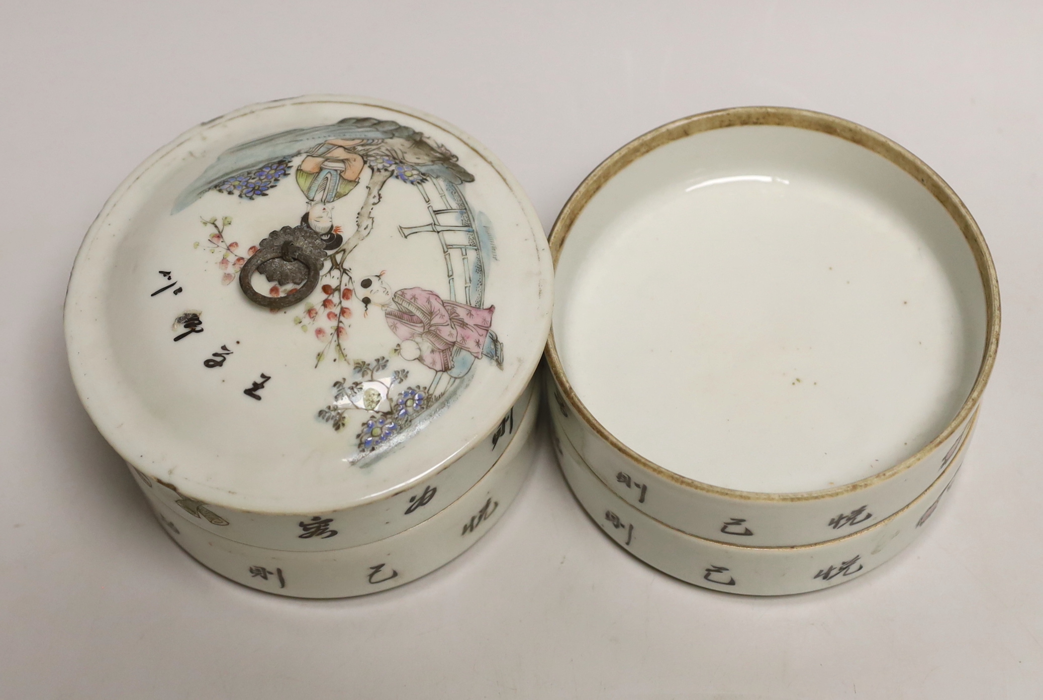 An early 20th century Chinese four section food container hand painted in the famille rose palette, 14cm high